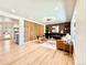 Open concept living room boasts hardwood floors, modern furnishings, fireplace, and stylish decor at 1559 S Forest St, Denver, CO 80222