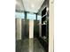 Close-up of the shower with black marble tile, and built-in shelving at 1559 S Forest St, Denver, CO 80222