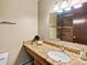 Bathroom featuring granite countertop, vanity sink, mirror, and walk in shower at 2800 Kalmia Ave # A310, Boulder, CO 80301