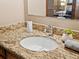 Bathroom vanity with granite countertop, modern faucet, and decorative accents at 2800 Kalmia Ave # A310, Boulder, CO 80301