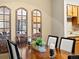 Cozy dining room featuring a wooden table, comfortable chairs, and a view of the modern kitchen at 2800 Kalmia Ave # A310, Boulder, CO 80301