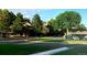 Community parking and manicured lawn space and lush trees at 2800 Kalmia Ave # A310, Boulder, CO 80301
