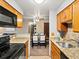 Updated kitchen featuring granite counters, stainless appliances, and seamless flow to dining area at 2800 Kalmia Ave # A310, Boulder, CO 80301