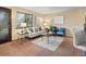 Bright living room with large windows, cozy seating, and stylish decor for relaxed living at 2800 Kalmia Ave # A310, Boulder, CO 80301