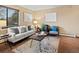 Bright living room with large window, comfortable seating, and stylish decor for a relaxing atmosphere at 2800 Kalmia Ave # A310, Boulder, CO 80301