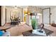 Open-concept living and dining area featuring bar seating, neutral colors, and carpeted floors at 2800 Kalmia Ave # A310, Boulder, CO 80301