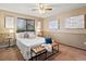 Cozy main bedroom featuring neutral walls, ceiling fan, and well-lit decorations at 2800 Kalmia Ave # A310, Boulder, CO 80301
