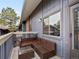 Comfortable patio seating with furniture, view of building, and outdoor access at 2800 Kalmia Ave # A310, Boulder, CO 80301