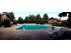 Outdoor pool featuring lounge chairs and surrounding greenery at 2800 Kalmia Ave # A310, Boulder, CO 80301