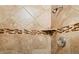 Close-up of showerhead and updated tile in walk-in shower at 2800 Kalmia Ave # A310, Boulder, CO 80301