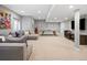 Finished basement featuring a seating area, ping pong table, and neutral paint colors at 1214 S Fillmore St, Denver, CO 80210
