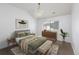 Cozy bedroom featuring a large window, natural light, and a comfortable bed at 1214 S Fillmore St, Denver, CO 80210