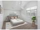 Bright bedroom with a large window, plush carpet, and a comfortable bed with side tables at 1214 S Fillmore St, Denver, CO 80210