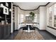 Charming breakfast nook with bright windows, dark cabinetry and dark hardwood floors at 1214 S Fillmore St, Denver, CO 80210