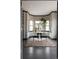 Dining area featuring a bay window, dark trim, hardwood floors and custom rug at 1214 S Fillmore St, Denver, CO 80210