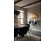 Stylish dining room with wood beams, unique lighting, and modern artwork for a cozy feel at 1214 S Fillmore St, Denver, CO 80210