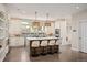 Bright kitchen with island, stone countertops, modern appliances and wood floors at 1214 S Fillmore St, Denver, CO 80210