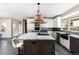 Spacious kitchen featuring stainless steel appliances, a large island, and a seamless sink design at 1214 S Fillmore St, Denver, CO 80210