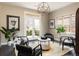 Comfortable seating area featuring natural lighting, hardwood floors and decorative accents at 1214 S Fillmore St, Denver, CO 80210