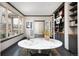 Bright living room with a large picture window, hardwood floors, and a marble table at 1214 S Fillmore St, Denver, CO 80210