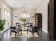 Sitting area with dark hardwood floors, unique orb chandelier, and ample natural light at 1214 S Fillmore St, Denver, CO 80210
