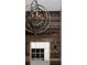Close up of wood accent wall with window and light fixture on stairway at 1214 S Fillmore St, Denver, CO 80210