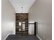 Bright stairwell featuring wood accent wall and modern orb chandelier at 1214 S Fillmore St, Denver, CO 80210