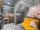 Cozy wine cellar with custom shelving, unique tile flooring, and a decorative sofa at 1214 S Fillmore St, Denver, CO 80210