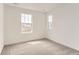 Bedroom featuring neutral carpet and a large window providing natural light at 15261 Fillmore St, Thornton, CO 80602