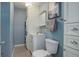 Cozy bathroom featuring a stackable washer and dryer, white vanity, and a matching framed mirror at 909 N Logan St # 1B, Denver, CO 80203