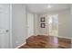 Bedroom featuring wood floors, a white closet door, and neutral wall color at 909 N Logan St # 1B, Denver, CO 80203