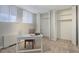 Bedroom with a work desk, neutral walls, carpet and a closet with adjustable shelving and drawers at 909 N Logan St # 1B, Denver, CO 80203