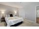 Bright bedroom featuring plush carpeting, neutral walls, and a view of the closet at 909 N Logan St # 1B, Denver, CO 80203