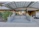 Building entrance with glass doors, sheltered overhead, and steps leading inside at 909 N Logan St # 1B, Denver, CO 80203