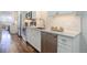 Kitchen features stainless steel appliances and white cabinets at 909 N Logan St # 1B, Denver, CO 80203