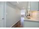 The kitchen countertops complement the stainless steel appliances, with a view of the adjacent living space at 909 N Logan St # 1B, Denver, CO 80203