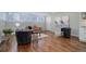 Bright living room with hardwood floors, seating, and decorative elements exudes a modern, comfortable atmosphere at 909 N Logan St # 1B, Denver, CO 80203