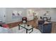 Inviting living room featuring hardwood floors, modern furnishings, and an open floor plan with eat-in kitchen at 909 N Logan St # 1B, Denver, CO 80203