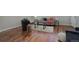 Hardwood floors and a soft rug accent the living room, featuring modern furnishings and neutral colors at 909 N Logan St # 1B, Denver, CO 80203