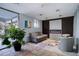 Cozy lobby area with comfortable seating, modern fireplace, tiled floors, and a variety of decor at 909 N Logan St # 1B, Denver, CO 80203