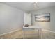 Home office featuring neutral paint, carpet, and a work space at 909 N Logan St # 1B, Denver, CO 80203