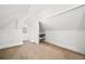 Bright attic space with built-in storage, offering a versatile area for organization and easy access to belongings at 161 W Maple Ave, Denver, CO 80223
