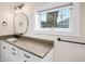 Bathroom vanity with granite counters and storage at 161 W Maple Ave, Denver, CO 80223