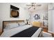 Bedroom with ceiling fan and light fixture at 161 W Maple Ave, Denver, CO 80223