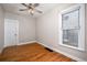 Bedroom with hardwood floors and window at 161 W Maple Ave, Denver, CO 80223