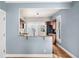 Bright eat-in kitchen with granite counters, wood cabinets, and stainless appliances at 161 W Maple Ave, Denver, CO 80223