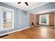 Bright living room featuring hardwood floors, a brick fireplace, and natural light at 161 W Maple Ave, Denver, CO 80223
