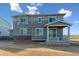 Two story home with gray siding and covered porch at 3494 N Irvington St, Aurora, CO 80019