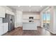 Modern kitchen with island, stainless steel appliances, and access to a patio at 3494 N Irvington St, Aurora, CO 80019