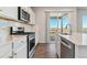 Modern kitchen with stainless steel appliances and white cabinets at 3494 N Irvington St, Aurora, CO 80019